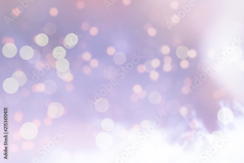Soft purple abstract bokeh light background with glowing circles and copy space