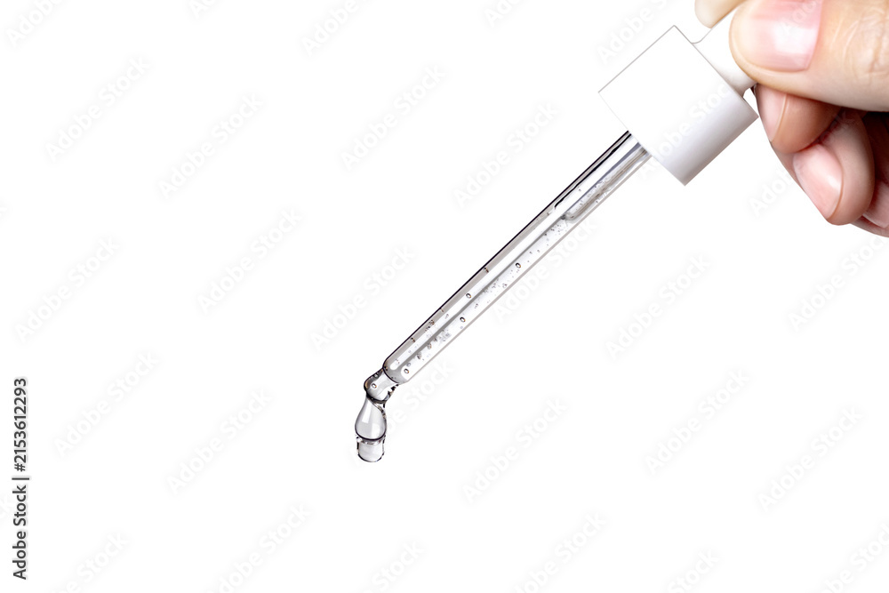 Fototapeta premium Cosmetic Pipette with serum in hand. Drips drop isolated on g white, close up