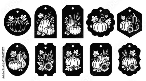 A collection of ten decorative black gift tags featuring white floral and pumpkin illustrations for autumn holidays and seasonal events isolated on transparent background
