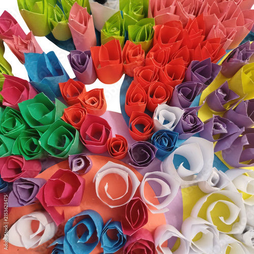 Multi color flower design made by  paper on white background