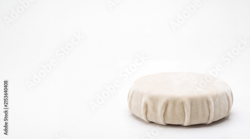 Artisanal Camembert Cheese: A perfectly formed wheel of artisanal Camembert cheese, enveloped in its distinctive bloomy rind, sits ready for enjoyment, a testament to culinary craftsmanship.