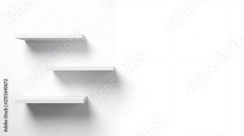 Minimalist Floating Shelves: Three clean, modern floating shelves are mounted on a stark white wall, offering a sleek and uncluttered display solution.