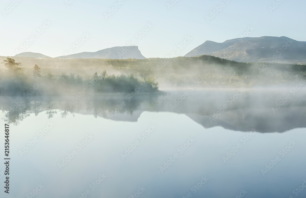 Fototapeta premium Sunrise lake landscape in autumn. Abisko national park in north of Sweden