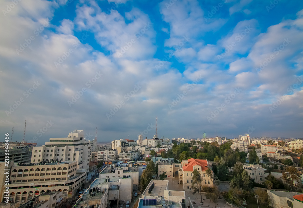 Fototapeta premium Dense Ramallah cityscape across rolling hills