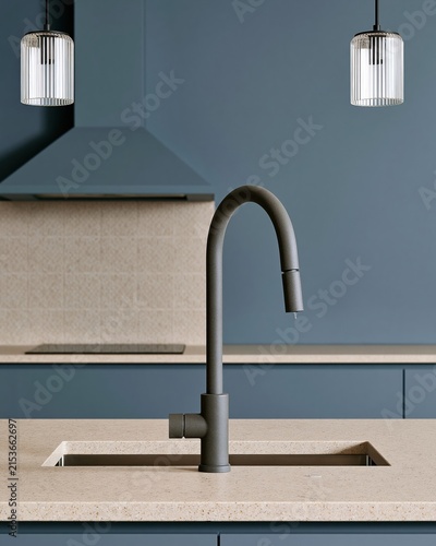 Tall bronze gooseneck faucet over an undermount sink on a beige stone island for premium kitchen remodel and interior design campaigns