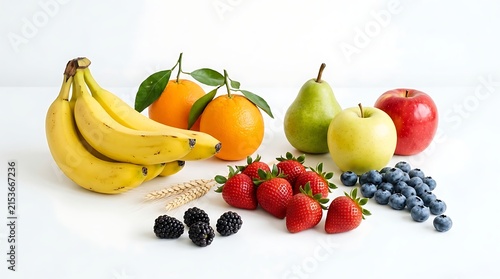 Fresh assorted fruits including bananas oranges strawberries blueberries apples and pears arranged neatly on clean white surface