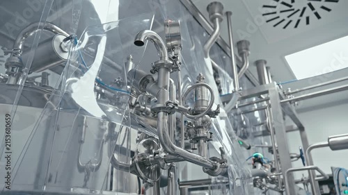Factory machine at work. Production equipment at medical industry. Pipes, valves, and gauges. 4K, UHD