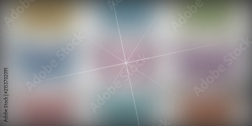 Abstract starburst background with soft colorful bokeh and grain fog.