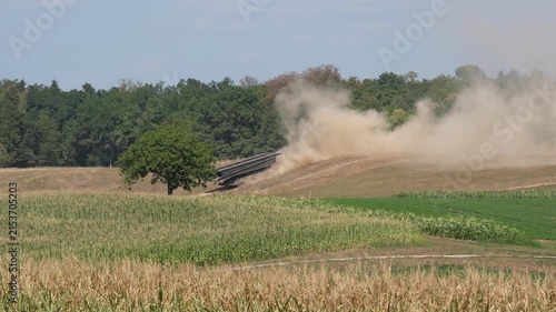 Armoured vehicle launched bridge of Swiss Army passing at military training grounds at city of Bülach on a hot and dry summer afternoon. Video shot August 11th, 2026, Zurich Oberglatt, Switzerland.
