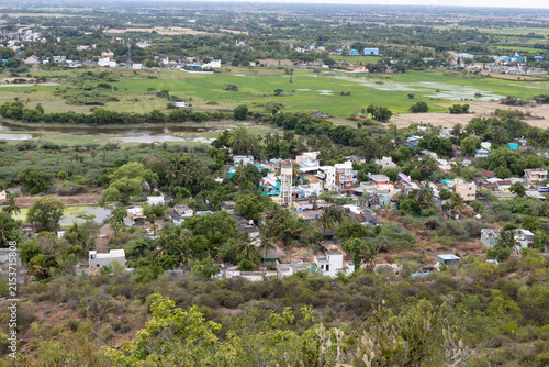 Indian Village Aerial View – Rural Landscape with Homes, Farmland and Greenery.