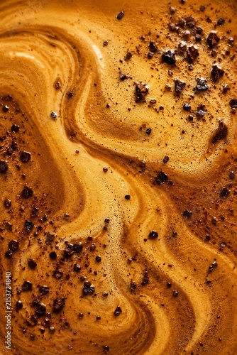 Rich espresso crema swirled with dark chocolate shavings and cocoa powder