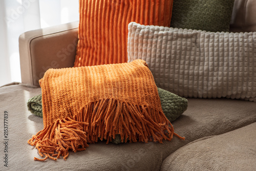 Obraz na plátně Cozy autumn home decor arrangement with textured pillows and plush throws