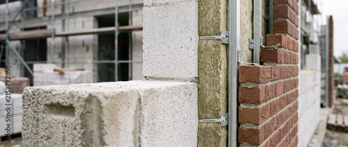 Panel kuchenny z motywem Construction detail showing brick wall, insulation and concrete block masonry on building site