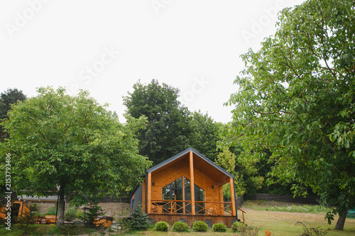 Photography Modern modular wooden cabin surrounded by nature