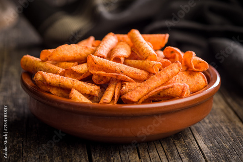 Фотография Spicy Rolled Corn Snacks in Bowl