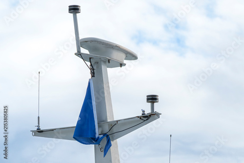 Photography Ship mast with radar and antennas on a vessel, illustrating marine navigation technology and maritime communication systems