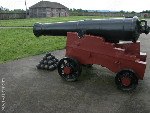 Fotografie Historic Black Cannon and Cannonballs On Red Carriage at Fort Vancouver, Vancouv