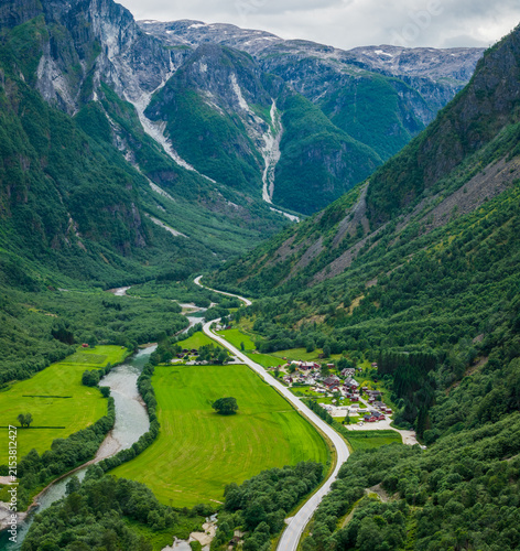 Aerial view of Gudvangen village at the end of the spectacular Naeroyfjord in Norway, surrounded by steep mountains dramatic landscape of the UNESCO World Heritage fjord region
