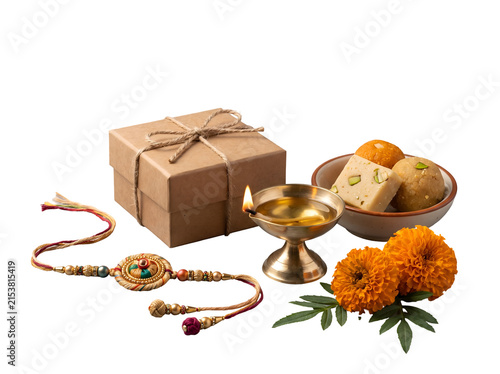 Premium Raksha Bandhan festival arrangement featuring handcrafted rakhi, gift box, brass diya, Indian sweets and marigold flowers isolated as a transparent PNG asset.