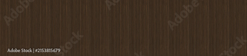 Wide panoramic texture of fine brown vertical fluted corduroy fabric grooves.
