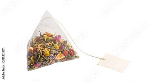 Pyramid tea bag with herbal blend, silk mesh infuser with loose leaf tea and flowers, premium organic tea sachet with blank tag isolated PNG with Transparent Background