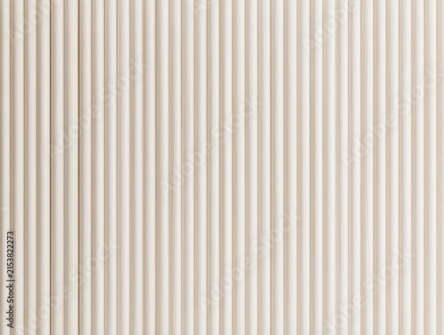 Closeup of light beige vertical fluted wall panel texture, modern interior design background with repeating rounded slats pattern