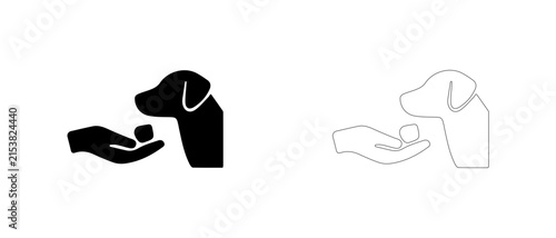 Hand giving treat to floppy eared dog vector icon filled and outline, positive reinforcement training symbol.