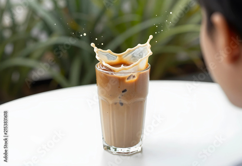 Iced coffee with a milk spl...