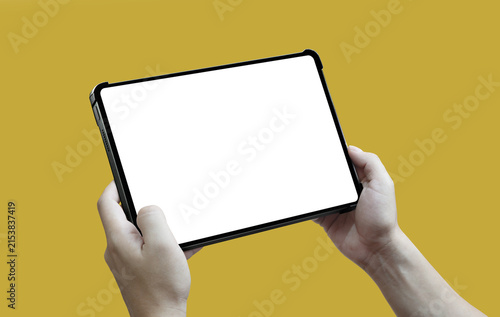Obraz na płótnie User hands holding a tablet with a protective case and white screen isolated on