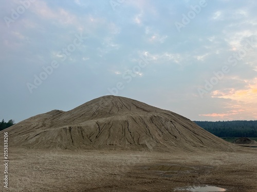 Big Gravel Hill With Exposed Stone, Loose Aggregate and Rugged Natural Terrain in an Open Outdoor Landscape