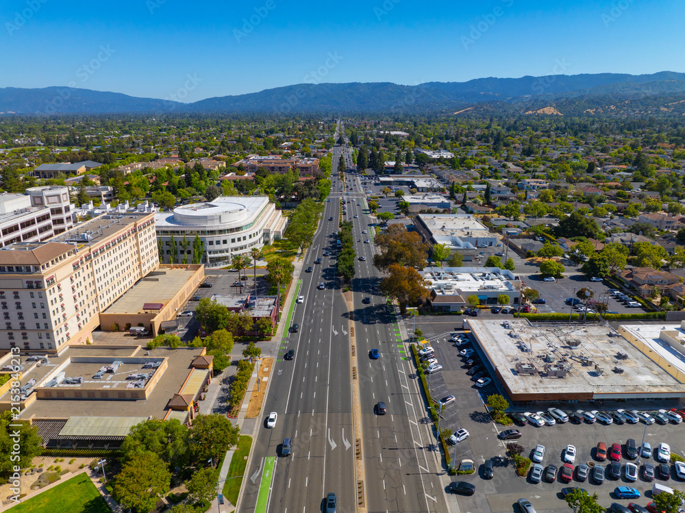 Fototapeta premium Cupertino city center aerial view facing south on S De Anza Blvd at Stevens Creek Boulevard near Civic Center of Cupertino, California CA, USA.