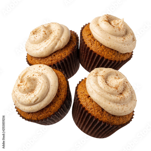 Pumpkin spice cupcakes with matte warm beige frosting and spice sprinkles - autumn bakery product isolated on transparent background