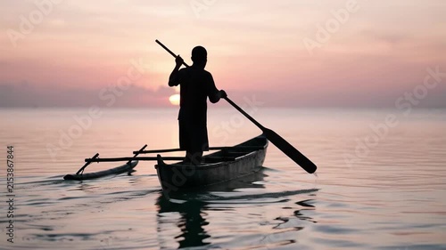 Fisherman rowing outrigger canoe at sunrise 4K Video