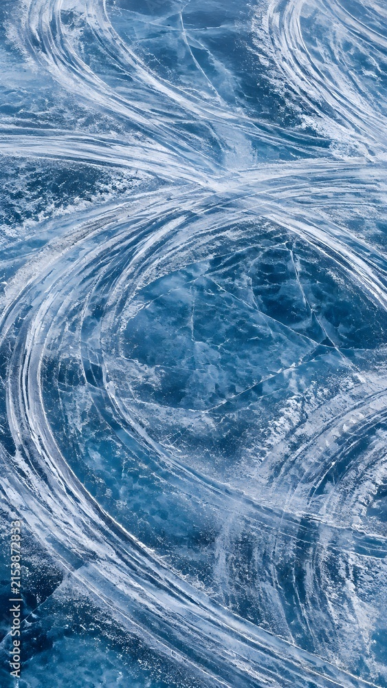 Obraz premium Ice Racing Skid Marks Sweeping Across Blue Frozen Lake for Abstract Motorsport Background and Design