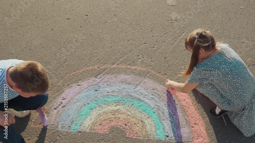 Kid child baby boy girl Sidewalk creation moment, small artists at play, making a rainbow, brother and sister drawing, pastel hues on street, artist duo, chalk art joy, summer sketch project, creative