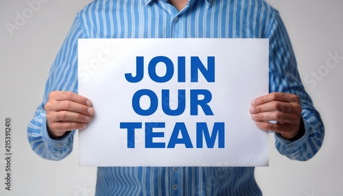 Businessman Holding a Join Our Team Sign for Recruitment and Hiring