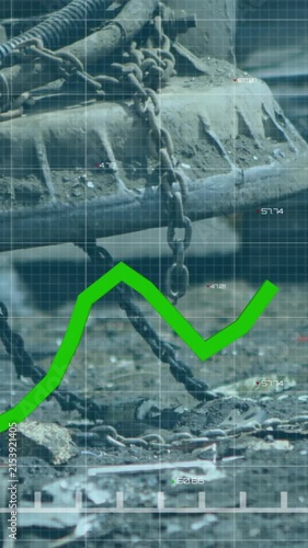 Animating green financial graph over industrial machinery in scrapyard setting