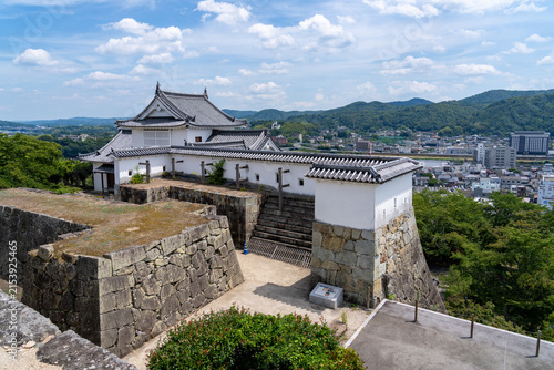 Konstfotografi The reconstructed Bitchu Yagura turret and historic stone walls of Tsuyama Castle (Kakuzan Park) in Okayama, Japan