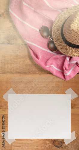 Summer Holiday Vacation Trip Mockup Concept Wallpaper with White Blank Free Space Paper Sheet with Adhesive Tape on Wooden Surface. File with Clipping Path.