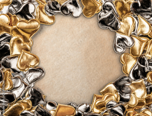Golden and Silver Hearts Adorn a Neutral Background Creating an Elegant Frame