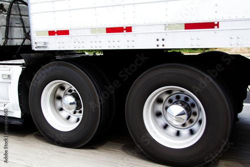 Tight Shot Of Wheels On Big Rig Truck Going Down The Road