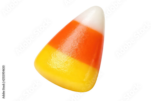 Candy corn close-up, orange yellow white Halloween sweet isolated on white background, festive autumn candy food photo