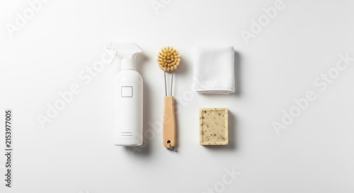 Obraz w ramie Cleaning supplies arranged against a white backdrop for various applications