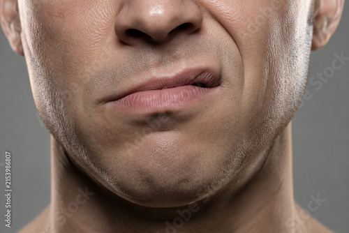 Sneering mouth close-up, emotion and attitude concept