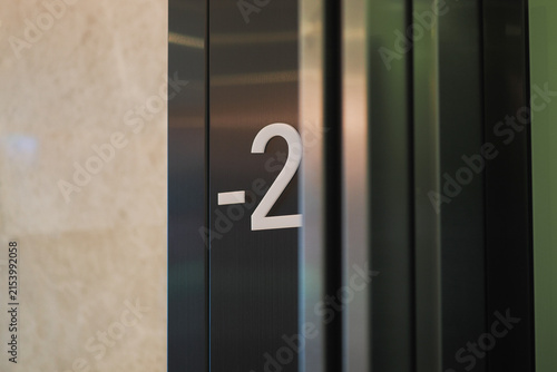 Konstfotografi Elevator sign showing level minus two in a building