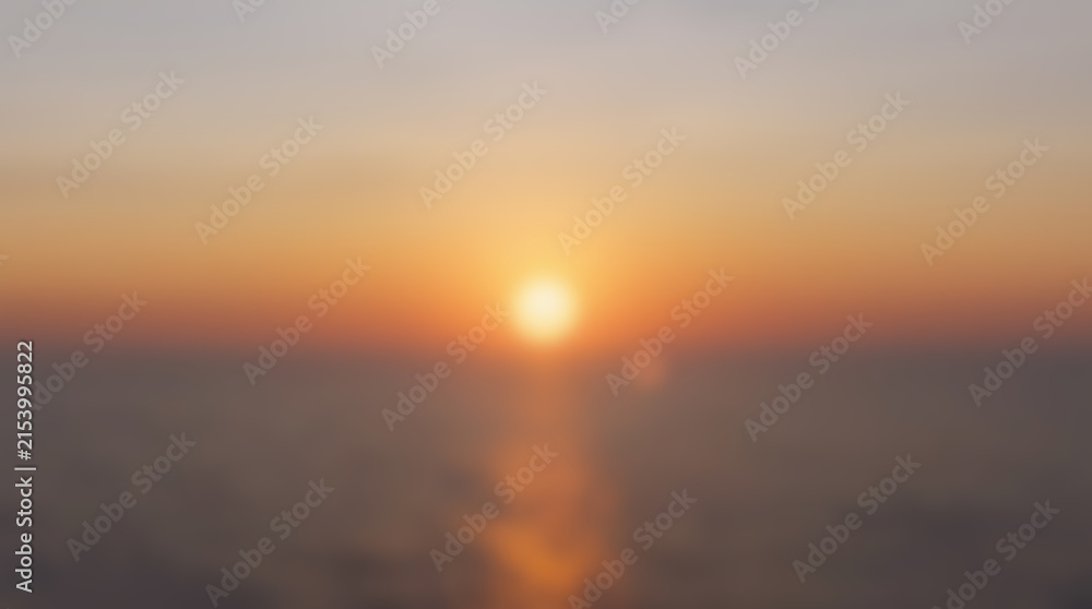 Fototapeta premium Golden sunset over the calm ocean with reflection on the water surface.