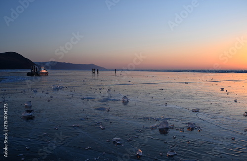 Sunrise on Lake Baikal in winter. Olkhon Gate Strait, Eastern Siberia, Russia