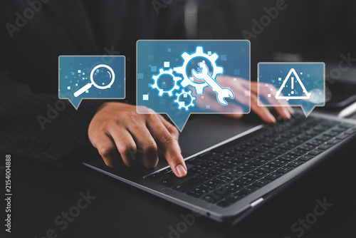 Online IT customer support. Remote help desk chat for technical support. Businesswoman using laptop computer to provide troubleshooting support.