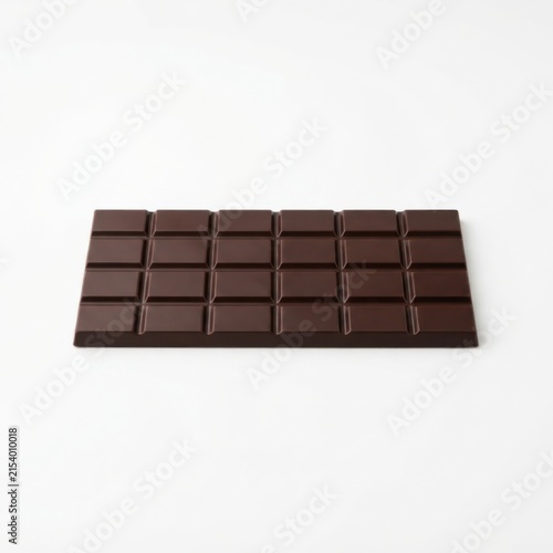Unwrapped dark chocolate bar on neutral background