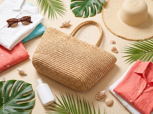Beach tote bag with sunglasses and palm leaves